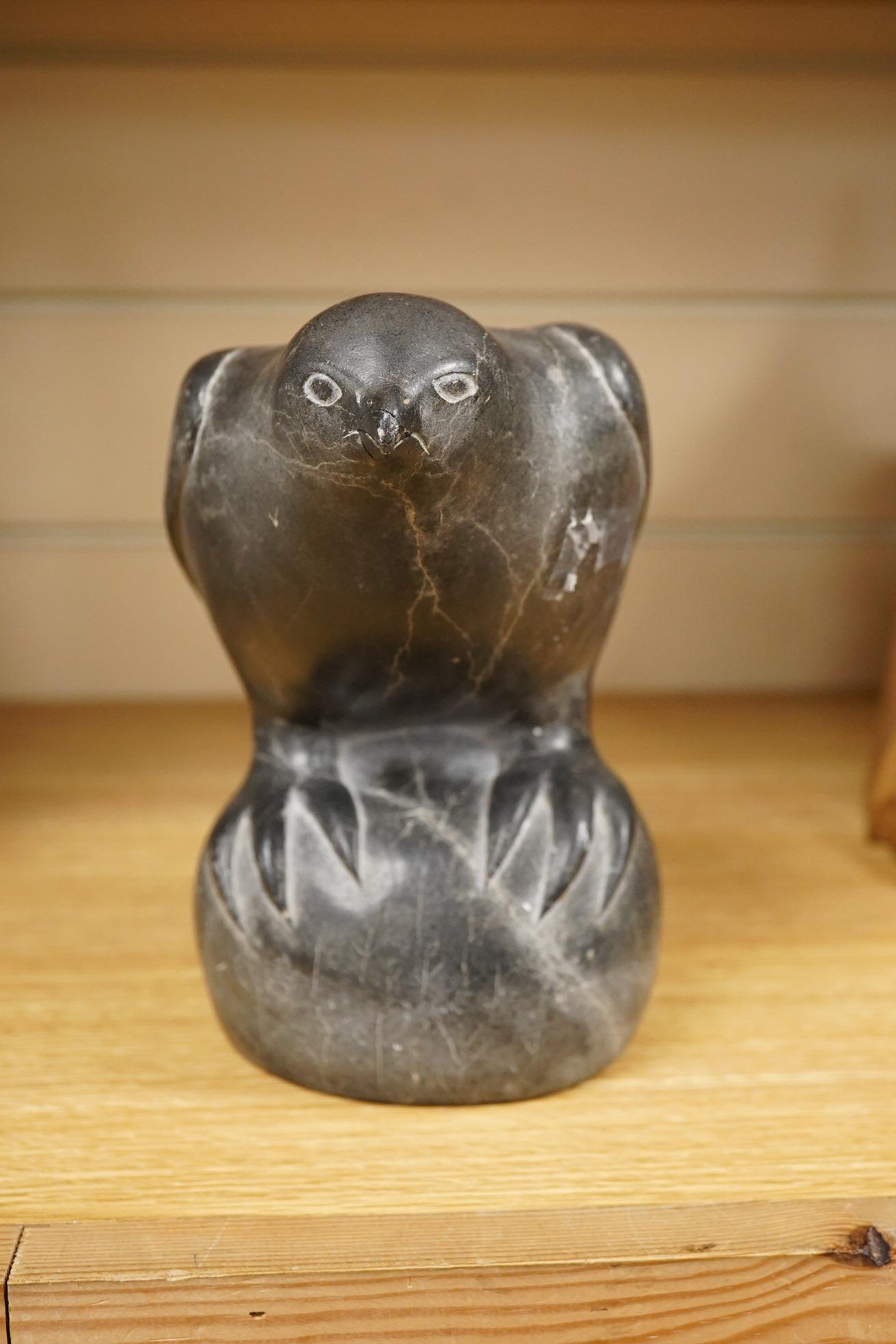 An Inuit stone carving of a falcon by Isapik, 18cm high